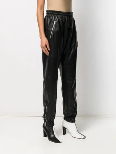 Shop Givenchy Zip Pocket Leather Trousers In Black