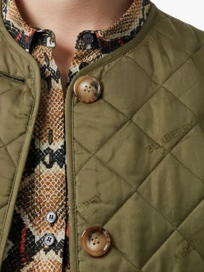 Shop Burberry Logo Print Quilted Jacket In Green