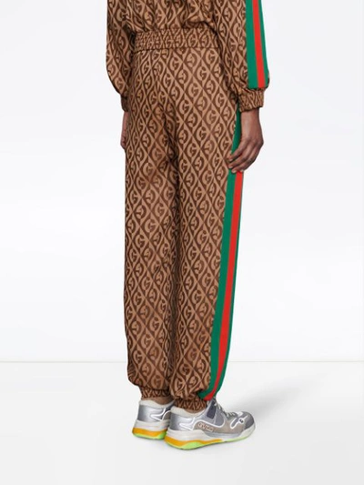 Shop Gucci Monogram Print Track Pants In Brown