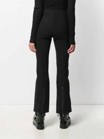 Shop Moncler Double-cuff Flared Trousers In Black