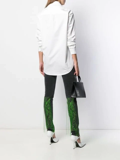 EMBROIDERED FRINGED SKINNY JEANS