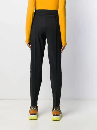 Shop Fendi Elastic Strap Hems Trousers In Black