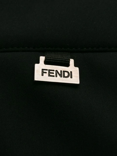 Shop Fendi Elastic Strap Hems Trousers In Black