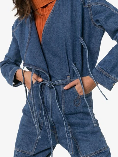 Shop Nanushka Naki Wrap Denim Jumpsuit In Blue