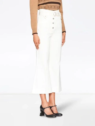 Shop Miu Miu Flared Belted Jeans In White