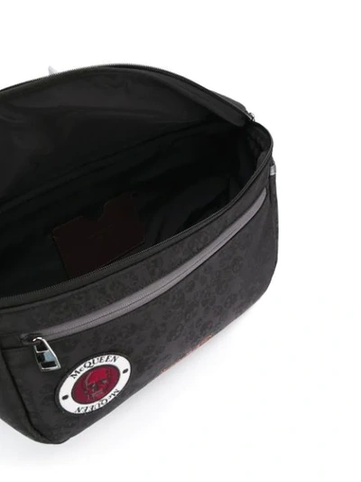 Shop Alexander Mcqueen Skull Appliqué-badge Belt Bag In Black
