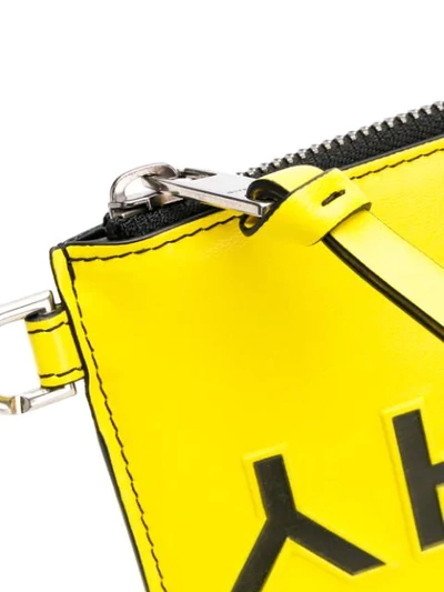 Shop Givenchy Logo Embossed Clutch In Yellow ,black