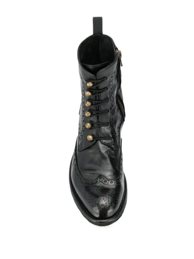 Officine Creative Punch-hole Detailed Leather Boots In Black
