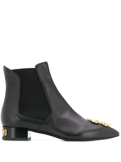 Shop Moschino Dollar Sign Plaque Ankle Boots In Black