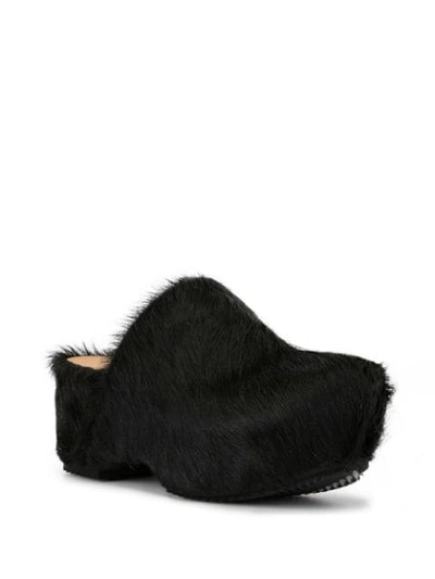 FUR-COVERED CLOGS