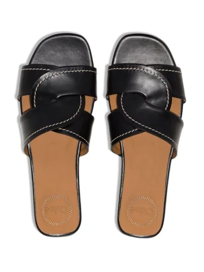 Shop Chloé Twist-strap Leather Slides In Black
