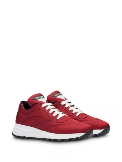 Shop Prada Stitched Details Low Top Sneakers In Red