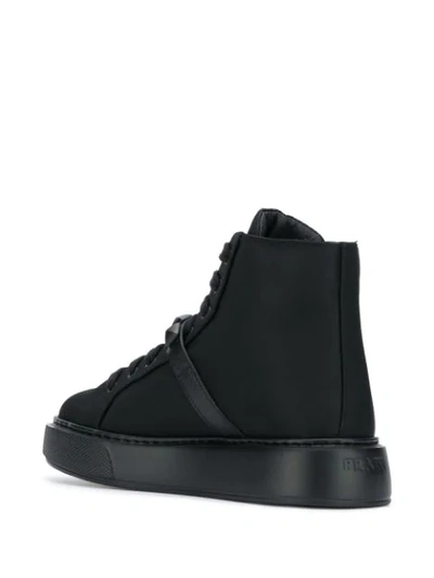 Shop Prada Buckled Strap High-top Sneakers In Black