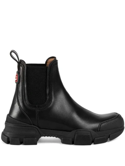 Shop Gucci Logo Patch Ankle Boots In Black