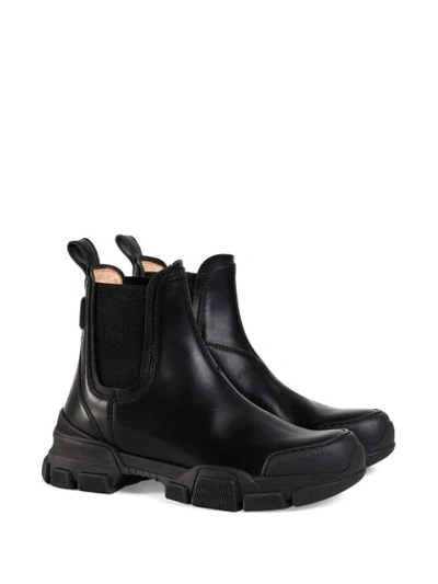 Shop Gucci Logo Patch Ankle Boots In Black