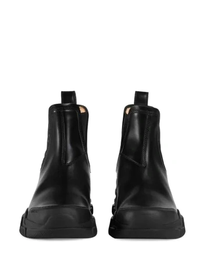 Shop Gucci Logo Patch Ankle Boots In Black