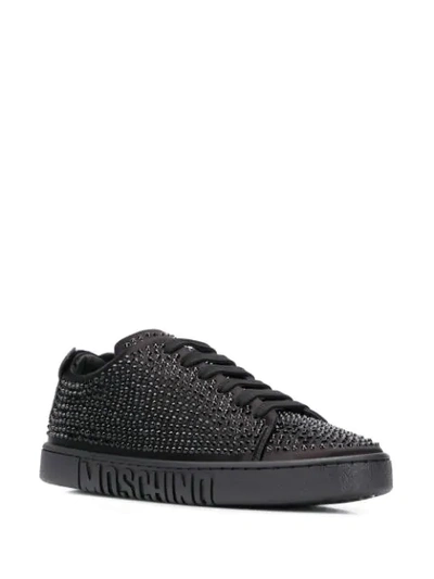 Shop Moschino Crystal Embellished Sneakers In Black