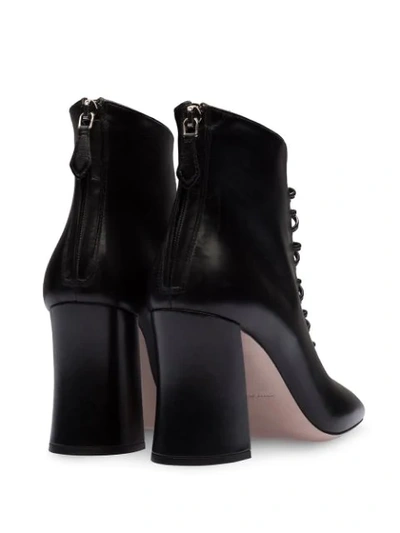 Shop Miu Miu Lace-up Booties In Black