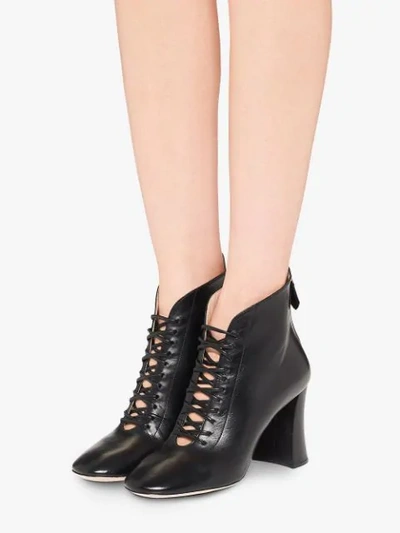 Shop Miu Miu Lace-up Booties In Black