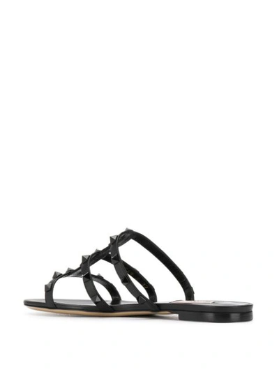 Shop Valentino Rockstud Flat Sandals In Black