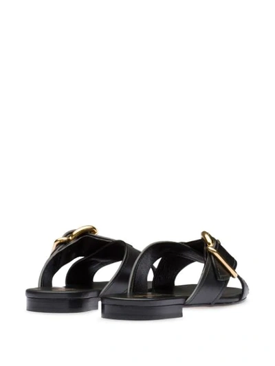 Shop Prada Buckled Flat Sandals In Black