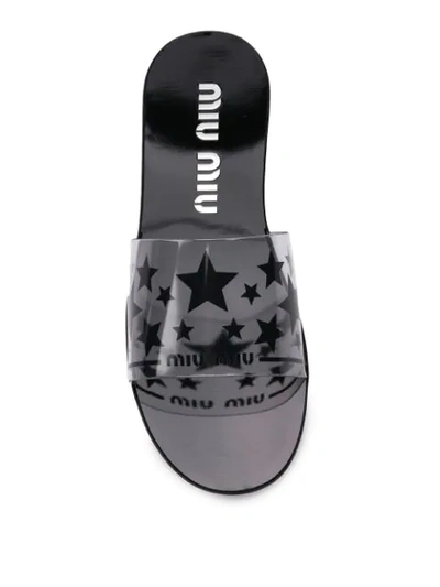 Shop Miu Miu Star Print Slides - Black