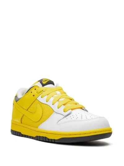 Shop Nike Wmns Dunk Low Sneakers In Yellow