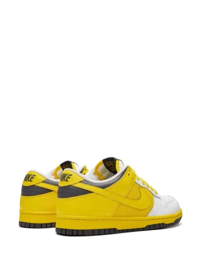 Shop Nike Wmns Dunk Low Sneakers In Yellow