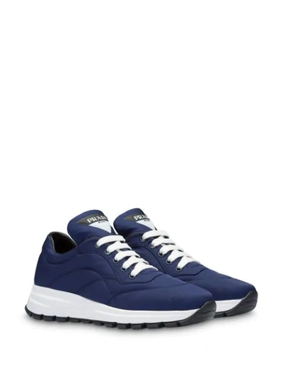Shop Prada Stitched Panels Low Top Sneakers In Blue