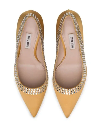 Shop Miu Miu Crystal Embellished Pumps In F0091 Ochre