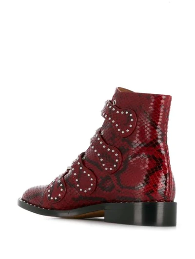Shop Givenchy Snakeskin Effect Buckled Ankle Boots In Red