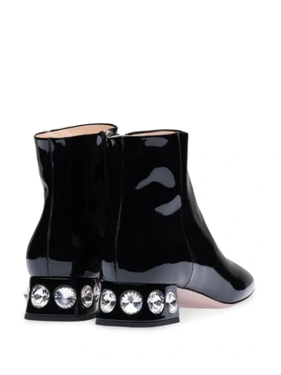 Shop Miu Miu Crystal-embellished Ankle Boots In Black