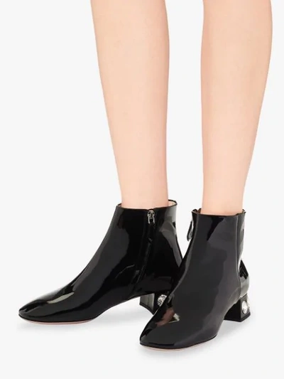 Shop Miu Miu Crystal-embellished Ankle Boots In Black