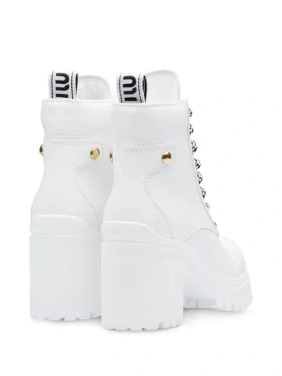 Shop Miu Miu Leather Booties In White