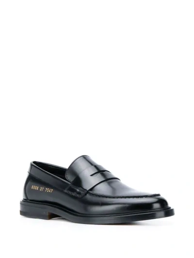 Shop Common Projects Embossed Logo Loafers In Black