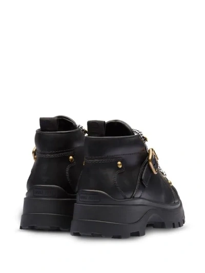 Shop Miu Miu Military Inspired Ankle Boots - Black