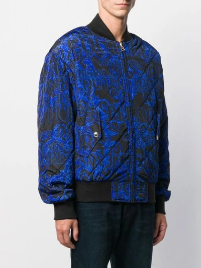 Shop Versace Jeans Couture All-over Logo Padded Jacket In Black