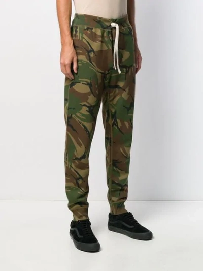 Shop Polo Ralph Lauren Camouflage Print Track Trousers In Green