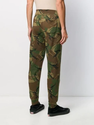 Shop Polo Ralph Lauren Camouflage Print Track Trousers In Green