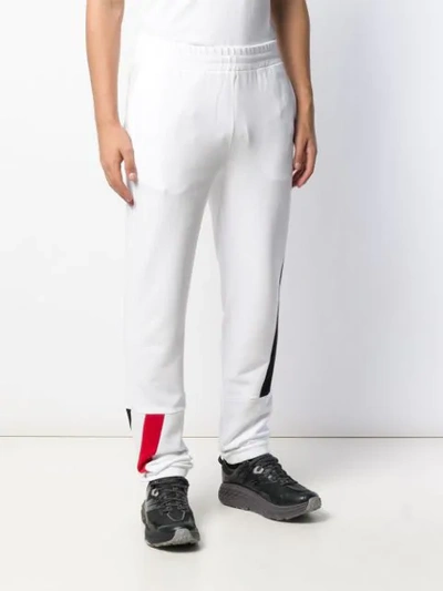 Shop Moncler Abstract Print Track Pants In White