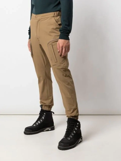 Shop White Mountaineering Tapered-leg Cargo Trousers In Brown