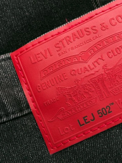 Shop Levi's 502 Tapered Jeans - Black