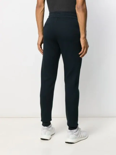 Shop Ea7 Slim Fit Track Pants In Blue