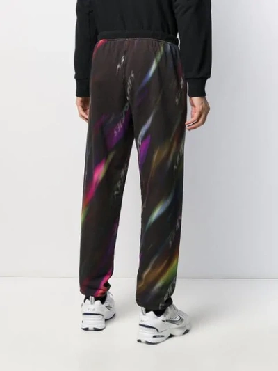 Shop Aries Long Logo Print Track Pants In Black