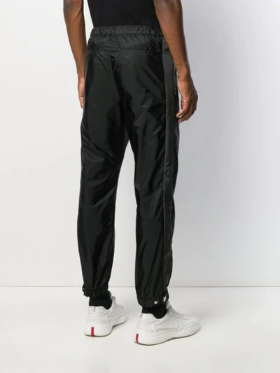 Shop Prada Panelled Tapered Trousers In F002l Nero+fumo