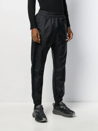 Shop Applecore Logo Embroidered Track Pants In Black