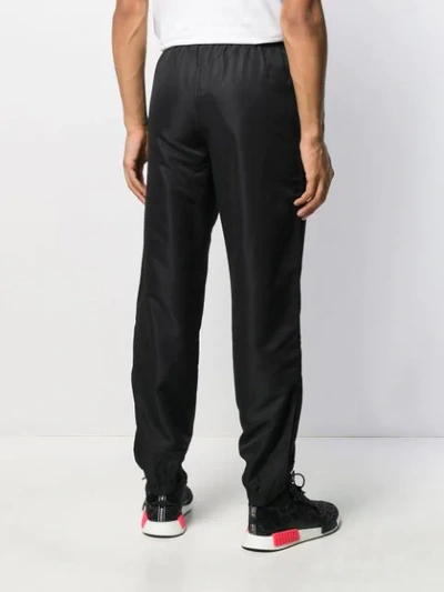 Shop Sergio Tacchini Shiny Track Pants In Black