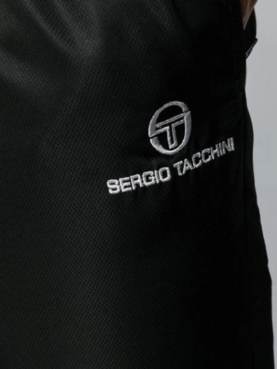 Shop Sergio Tacchini Shiny Track Pants In Black