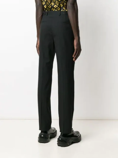 Shop Givenchy Ribbon Trimmed Logo Trousers In Black