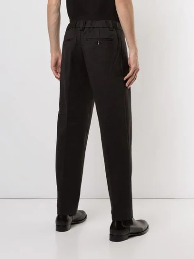 Shop Emporio Armani Tapered Tailored Trousers In Black